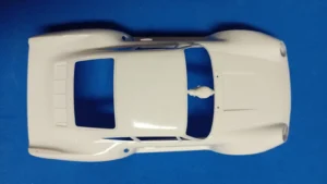 Box art of the Gunze Sangyo 1:24 scale Porsche 959 Rally Paris-Dakar High Rider plastic model kit featuring the #185 Rothmans livery